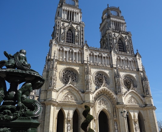 To illustrate an Orleans cathedral tour the photo shows the western facade of the edifice under the nice bleu sky of the Loire Valley in France.