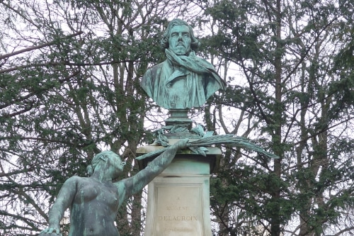 Photo of a Bronze sculpture of Delacroix in the garden of Palais du Luxembourg to illustrate  the Orsay and  Saint-Germain-des-Prés Guided Tour; Paris, France.