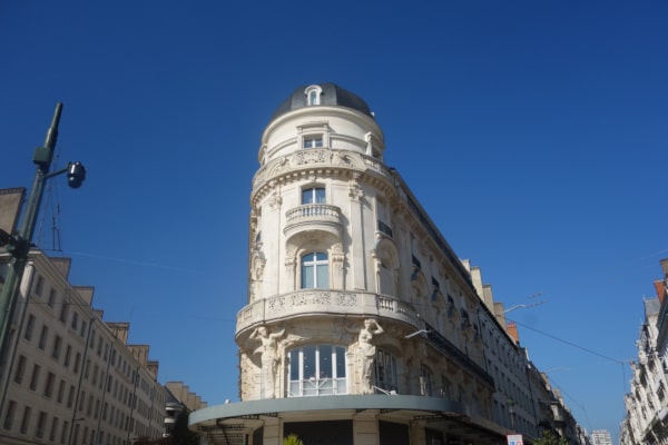 Belle Epoque Building with its two Art Nouveau caryatides in République street, Orléans, Loire Valley, France.