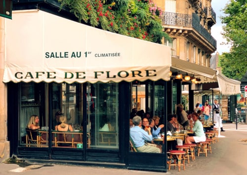 Photo of Café de Flore, famous café to illustrate a classic subject of a Saint-Germain-des-Prés Guided Tour, in Paris, France.