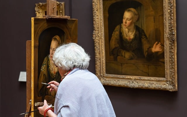 Photo of an artist painting in the Louvre to illustrate the Louvre Private Tour in Paris, France.
