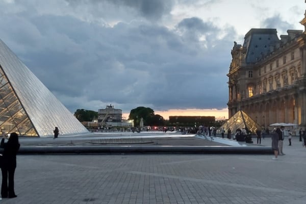 Photo of the Louvre Pyramid at night to illustrate the Louvre Evening Tour; Paris, France.
