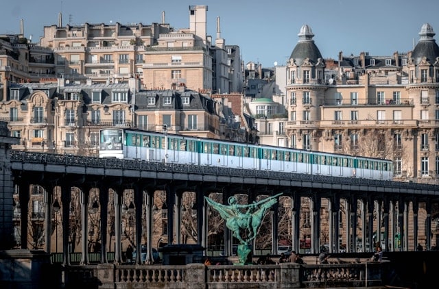 A Paris elevated Metro station with Parisian art nouveau buildings in the background