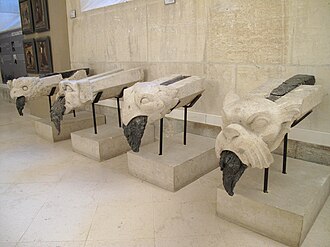 Gargoyles in Palais du Tau, Reims. Because of the 1914 fire, there is melted lead in their channel instead of water.