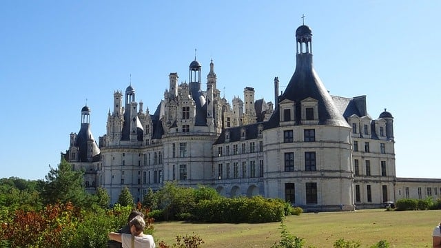 Oblique view of Chambord from the corner of the formal gardens showing both front and side facades.