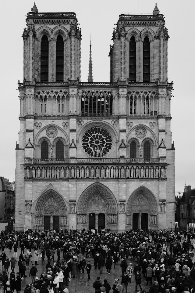 Notre Dame cathedral crowded foreground at midday, Paris, France.