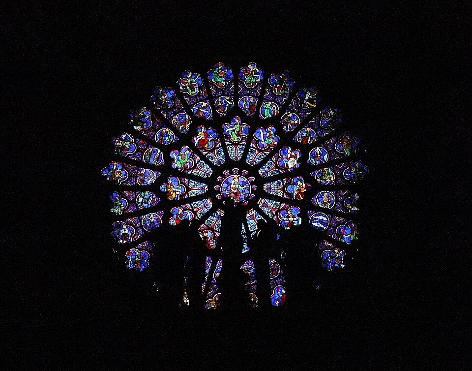 Notre Dame de Paris West Rose from inside with the shade of the outside sculptures of the facade.