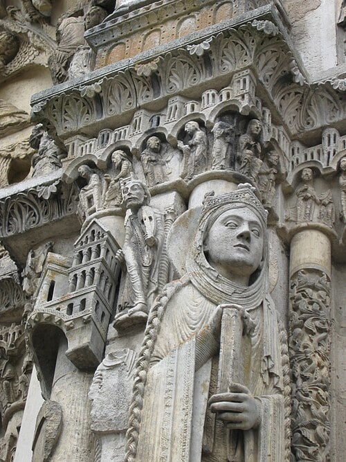 Royal Portal of Chartres Cathedral west facade showing three carved Romanesque doorways with column statues of Old Testament kings and queens, tympana, and archivolts dating from approximately 1145 to 1155